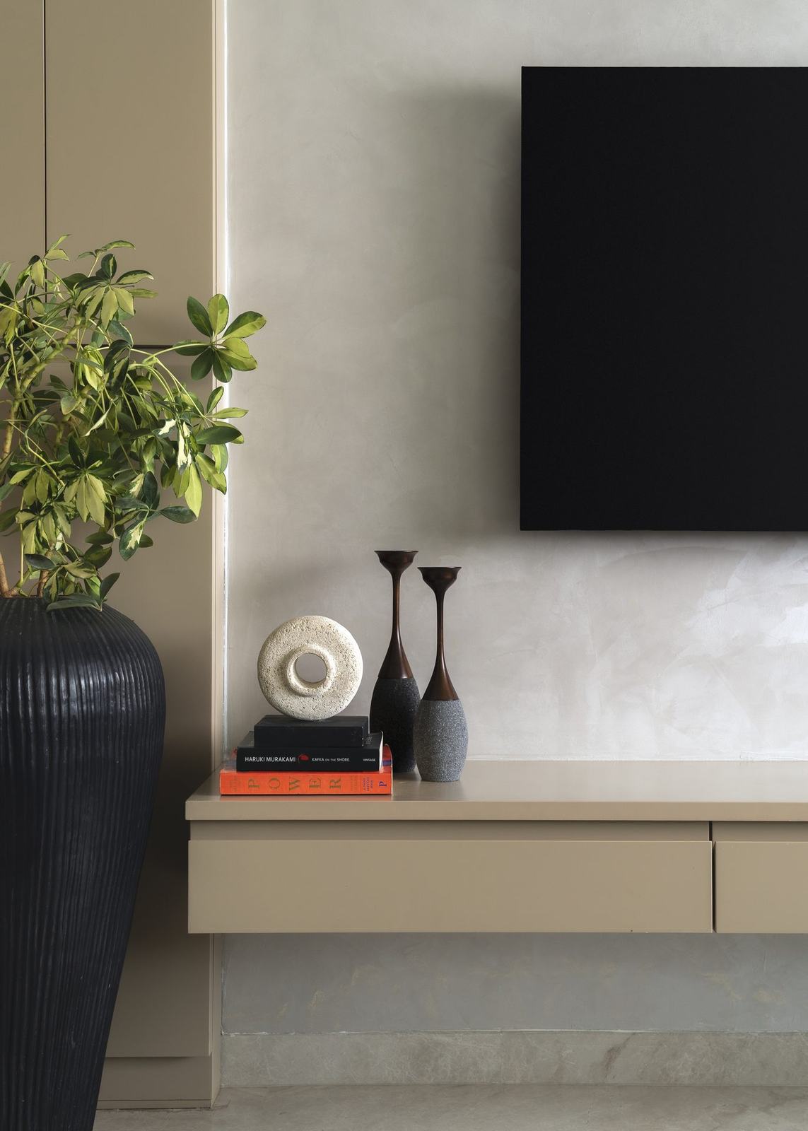 Console table with a vase styled in the Epure Residence living room by Feel and Bari