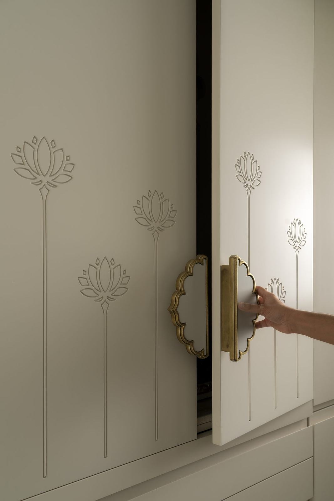Brass handle detail on a prayer cabinet in the Epure Residence by Feel and Bari