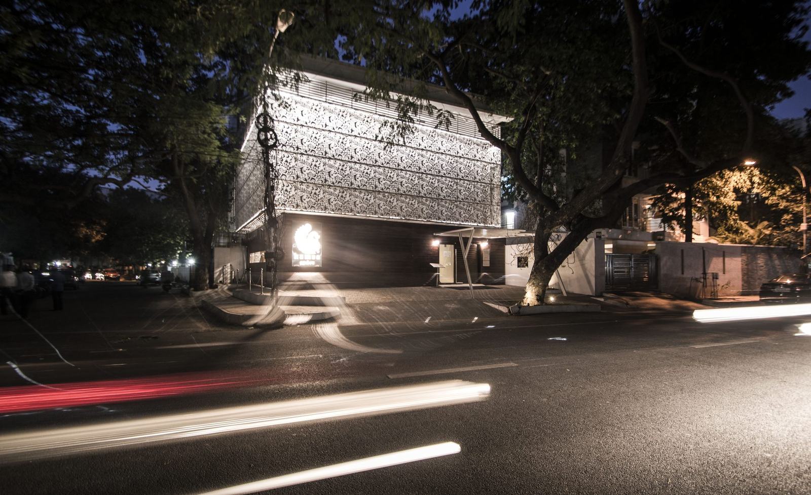 Perforated jaali facade of Hamsa in Chennai lit at night, by Feel and Bari
