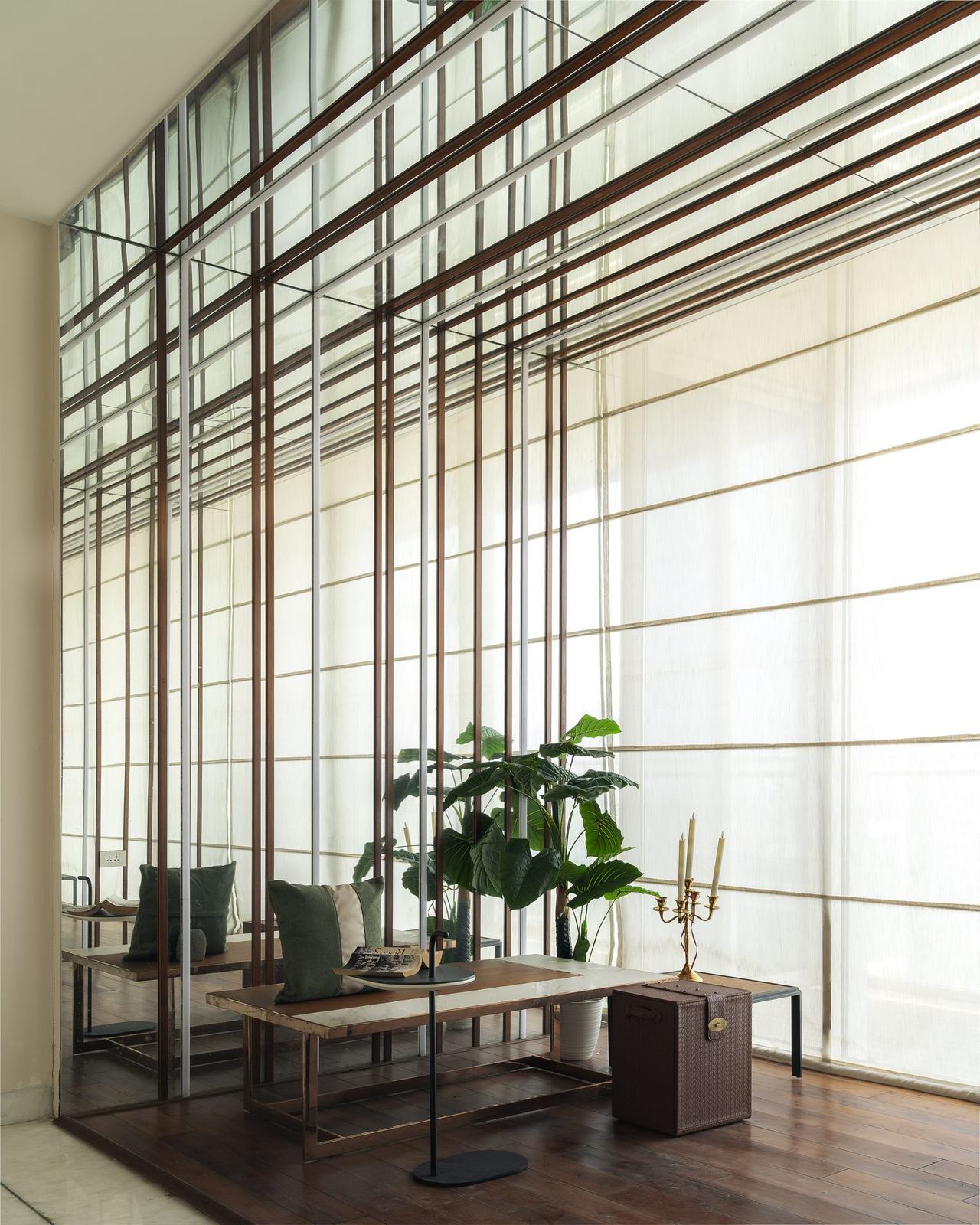 Foyer with a timber grid mirror wall in Rio The Penthouse by Feel and Bari