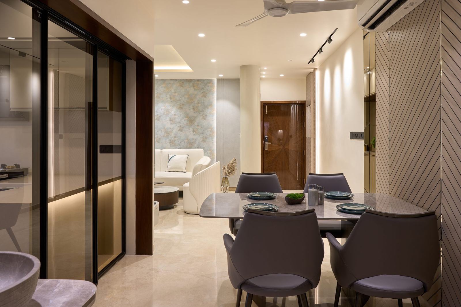 Open-plan dining area seen from the entrance in the Vida residence by Feel and Bari