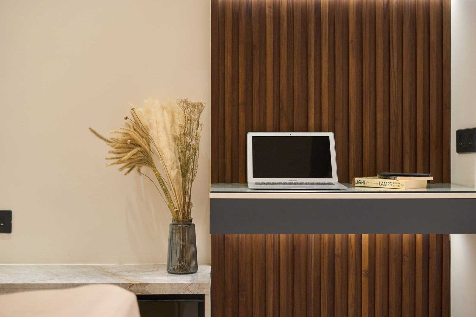 Home study nook with a fluted wood desk in the Vida residence by Feel and Bari